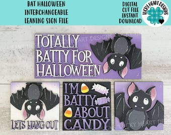 May include: A Halloween-themed sign set featuring a purple rectangular sign with the text "TOTALLY BATTY FOR HALLOWEEN" and a bat illustration. Additional square signs read "LET'S HANG OUT" and "I'M BATTY ABOUT CANDY".