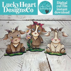 Puede incluir: Tres recortes de cabras de estilo caricaturesco en tonos marrón, beige y blanco. Cada cabra tiene orejas grandes y cuernos. Una cabra sostiene flores. La imagen incluye el texto "LuckyHeart Designs Co" y "Digital cut file instant download."