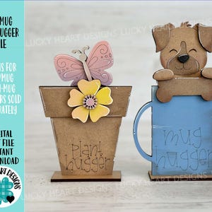 May include: Two wooden mug huggers. One is a brown flower pot with a yellow flower and a pink butterfly. The text "Plant hugger" is on the pot. The other is a blue mug with a brown dog on top. The text "mug hugger" is on the mug.