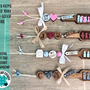 May include: Wooden tiered tray wood scoop file with decorative elements. Each scoop features a family-themed design with text and small wooden figures. The design includes text such as "Home", "Party of 7", and "Family".