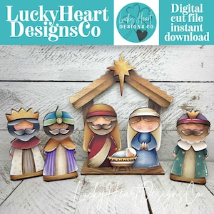May include: Wooden nativity scene with five figures and a stable. The figures include the three wise men, Mary, Joseph, and baby Jesus. The text "LuckyHeart Designs Co" and "Digital cut file instant download" are visible.