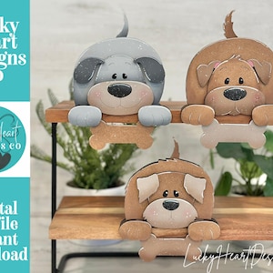 May include: Three-tiered wooden shelf with three cartoon dog cutouts. The dogs are gray, brown, and tan, each holding a bone. The text "Lucky Heart Designs Co" and "Digital cut file instant download" are visible.