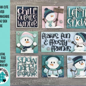 Peut inclure: Ensemble de panneaux décoratifs interchangeables sur le thème de l'hiver avec des bonhommes de neige. Chaque panneau présente un design unique avec des phrases comme "Chill out it's winter" et "Let it snow". Les panneaux sont de différentes couleurs, dont le bleu, le rose et le blanc.