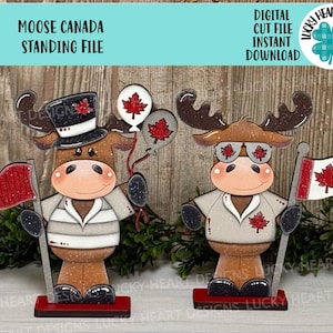 May include: Two wooden moose figurines, each holding a Canadian flag or balloons with maple leaf designs. One moose wears a top hat, the other sunglasses. The text "MOOSE CANADA STANDING FILE" and "DIGITAL CUT FILE INSTANT DOWNLOAD" are at the top.