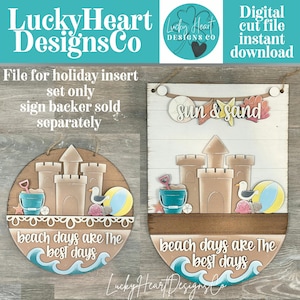 May include: Two beach-themed wooden signs. One is round with a sandcastle, bucket, seagull, and beach ball. The other is rectangular with a sandcastle and the words "sun & sand". Both signs have the text "beach days are the best days".
