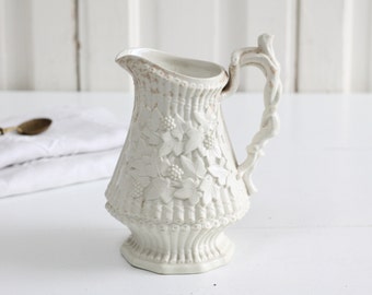 1849 Antique stoneware pitcher w relief molded vine decor and branch handle , Sylvan Cane Parian milk jug, Ridgway & Abbington, Church works