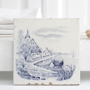 Vintage ceramic tile, blue transfer decor of village panorama w boat church, trivet by Gilliot & Roelants Belgium