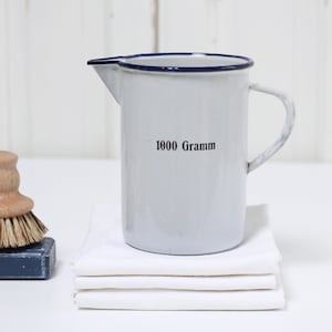Vintage German white enamel measuring jug with blue trim, old enamelware pitcher black lettering 1000 GRAMM, Farmhouse style decor