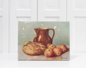 Vintage chippy oil painting on canvas, kitchen table still life with a pitcher, fruit and a loaf of bread