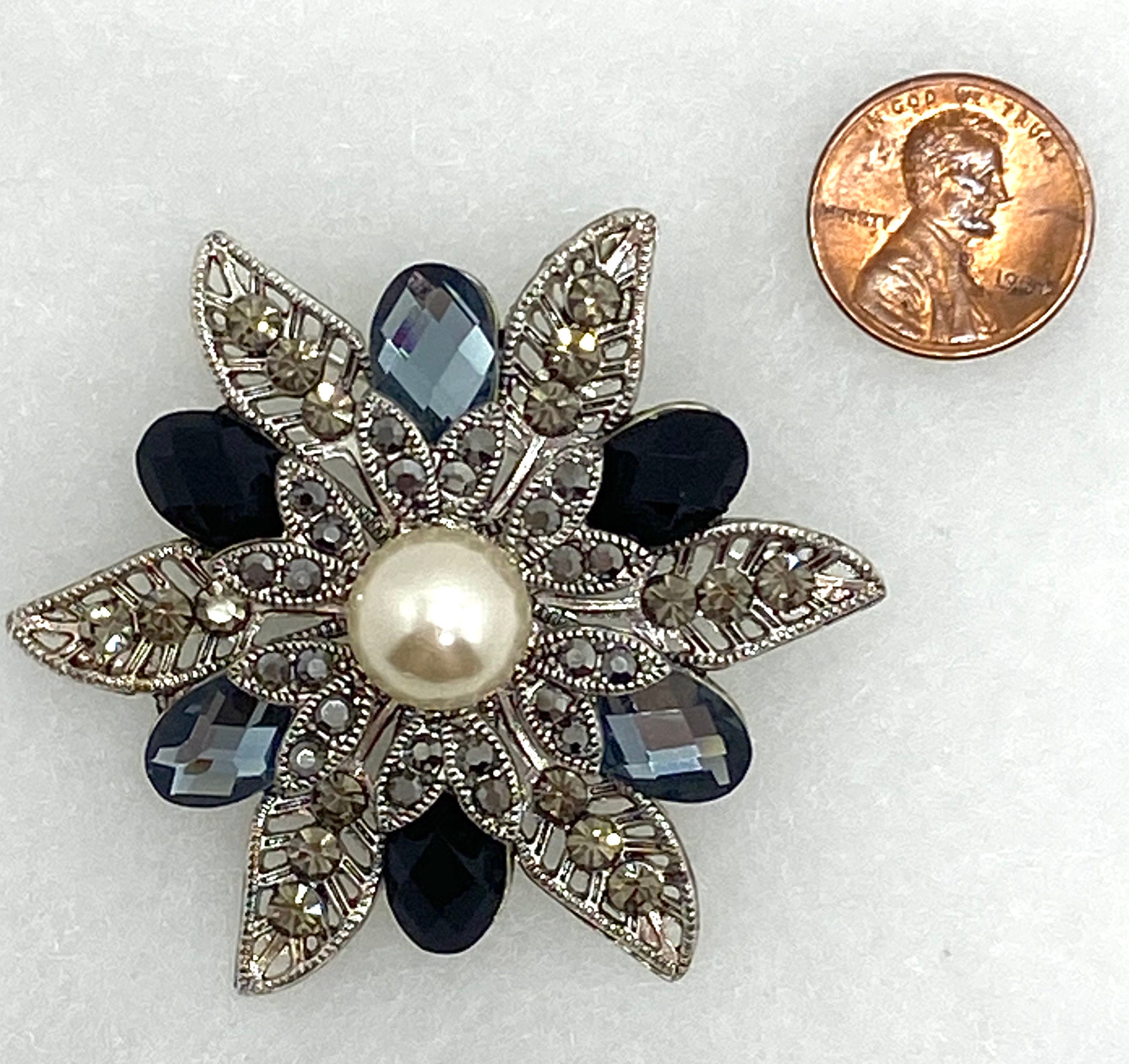 Vintage silver tone brooch with grey rhinestones