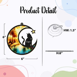 May include: A 6-inch diameter wooden moon and star ornament with a stained glass sunset scene. A black silhouette of a cat with the name "Cooper" is sitting on the moon. The ornament comes with a suction cup and an 8-inch chain.