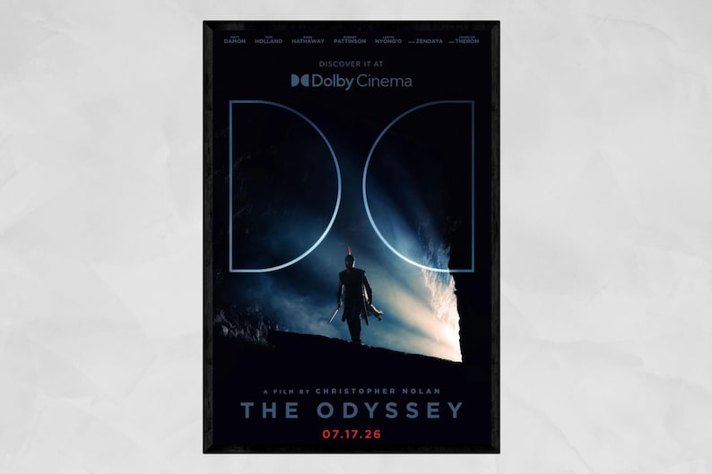 May include: A movie poster for The Odyssey, a film by Christopher Nolan. The dark blue design features a silhouetted figure standing before a bright light, framed by two large white semi-circles. Text includes Dolby Cinema, 07.17.26.