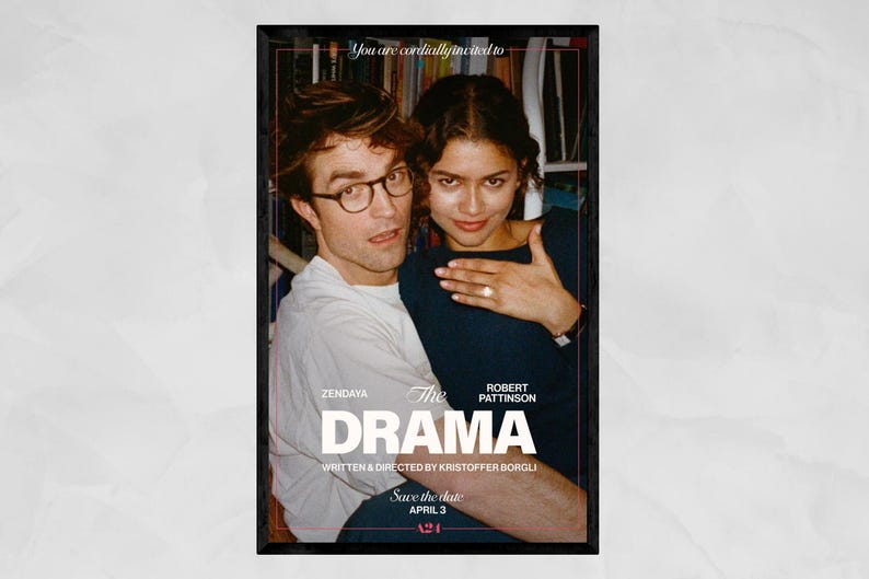 May include: A framed movie poster featuring Zendaya and Robert Pattinson. The title "The Drama" is prominently displayed, with the text "Save the date APRIL 3" below. The actors are embracing, with a bookshelf visible in the background.