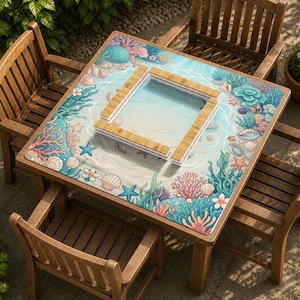 May include: A square wooden table with a marine-themed design, surrounded by four wooden chairs. The table features a colorful illustration of an underwater scene with coral, seashells, and a pool-like structure. The chairs are made of dark wood.
