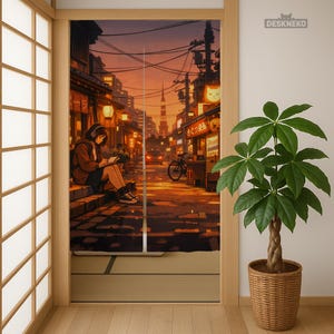 May include: A decorative room divider featuring an anime-style illustration of a street scene at dusk. A person wearing headphones sits reading on steps. The scene includes shops, a bicycle, and a tower in the distance. A potted plant is to the right.