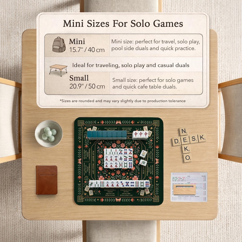 May include: A Mahjong set featuring a dark green floral play mat, white tiles with red and blue characters, a small bowl of green marbles, a brown notebook, and a wooden tile rack. An informational sign displays sizes of 15.7 inches and 20.9 inches.