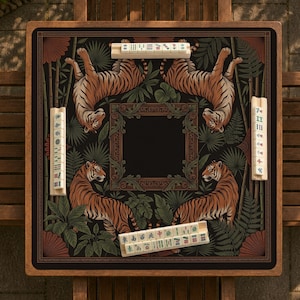 May include: Square Mahjong game board with a black background featuring four tigers, lush green foliage, and decorative borders. The board includes several sets of tiles with Chinese characters. The wooden frame adds a classic touch.