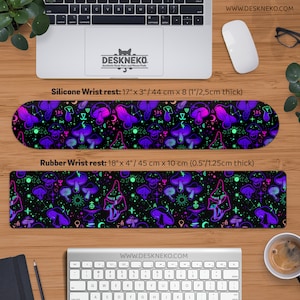 May include: Two wrist rests with a black background and a pattern of purple, pink, and green mushrooms and celestial symbols. The silicone wrist rest is 17 inches long, 3 inches wide, and 1 inch thick. The rubber wrist rest is 18 inches long, 4 inches wide, and 0.5 inches thick.