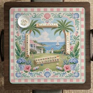 May include: A decorative Mahjong game set with a tropical beach scene. The game board features a pink and white checkered border, a coastal landscape, and various game pieces. Includes a small white bowl with dice.