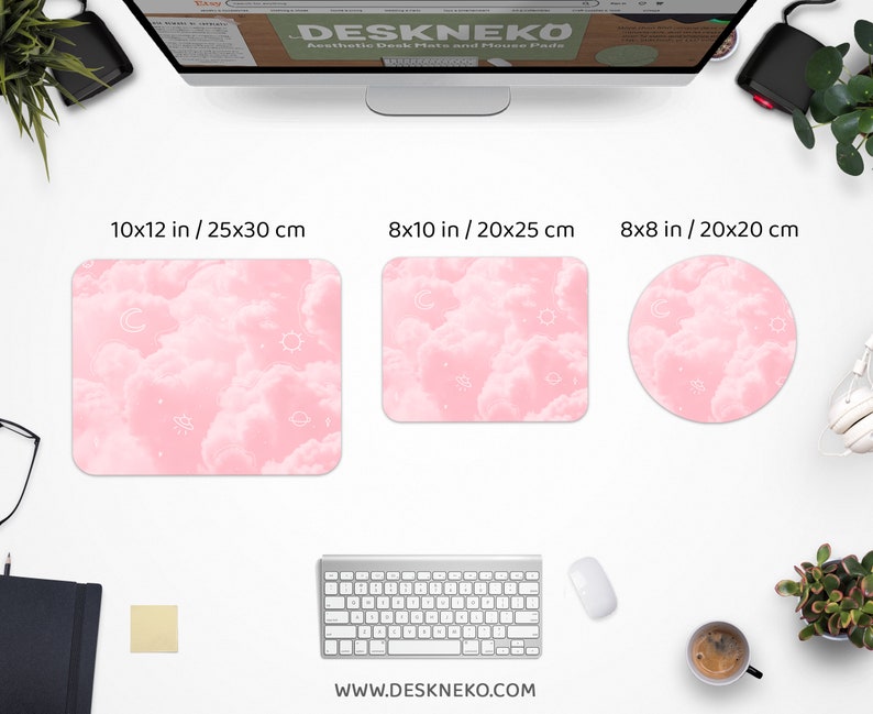 May include: Three aesthetic desk mats and mouse pads in different shapes and sizes. The mats feature a pink cloud design with white celestial accents. The largest mat is 10x12 inches, the medium is 8x10 inches, and the smallest is 8x8 inches. The website address is www.deskneko.com.