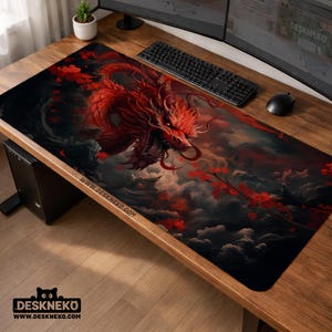 May include: A rectangular desk mat with a striking design of a red dragon against a dark, cloudy backdrop. Red floral elements and the website address "WWW.DESKNEKO.COM" are also displayed.