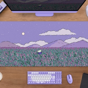May include: A rectangular lavender mousepad featuring a whimsical illustration of a field of lavender flowers under a starry sky. A cartoon character is in the field. The mousepad is surrounded by a keyboard, mouse, and other computer accessories.