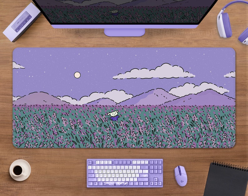 May include: A rectangular lavender mousepad featuring a whimsical illustration of a field of lavender flowers under a starry sky. A cartoon character is in the field. The mousepad is surrounded by a keyboard, mouse, and other computer accessories.