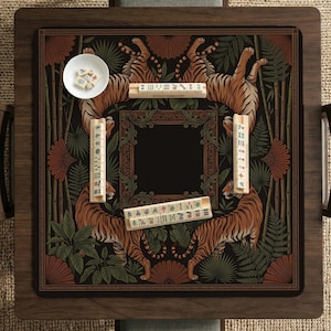 May include: A wooden mahjong table with a decorative playing surface featuring tigers, bamboo, and foliage. The table includes a bowl of dice and several sets of tiles. The color palette includes shades of brown, green, and orange.