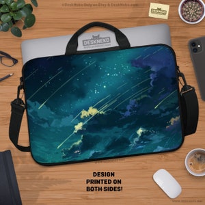 May include: Laptop sleeve with a celestial design featuring a night sky with shooting stars, clouds, and a teal and blue color palette. The sleeve has a black handle and shoulder strap. The text "DESIGN PRINTED ON BOTH SIDES!" is visible.