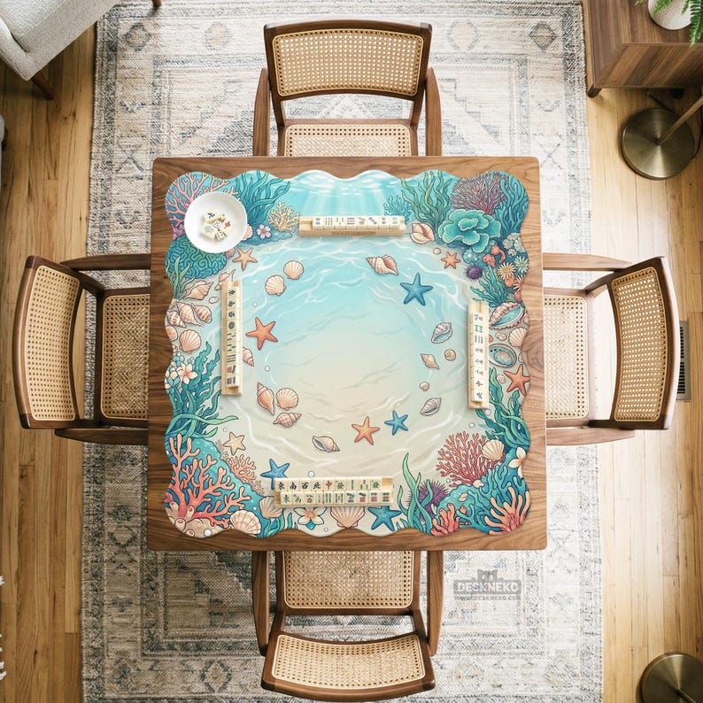 May include: A square wooden Mahjong table with a marine-themed design, surrounded by four woven chairs. The table features a light blue ocean scene with seashells, starfish, and coral. The table is approximately 36 inches square.