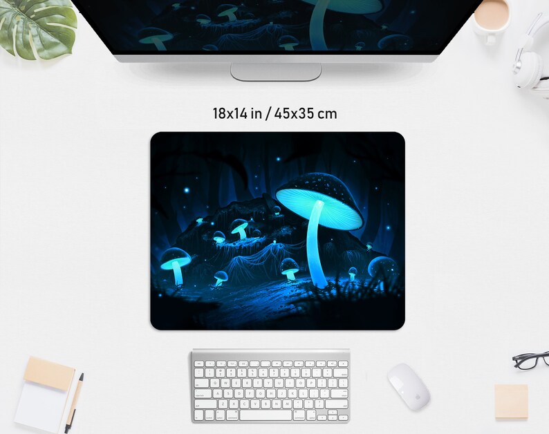 May include: A rectangular mousepad featuring a fantasy scene with glowing blue mushrooms in a dark forest. The mousepad measures 18x14 inches.