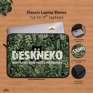Product image of a DeskNeko classic laptop sleeve displayed on a wooden desk. The sleeve features a green leafy botanical pattern. A macbook pro laptop is partially inserted into the sleeve, showing a snug fit suitable for laptops from 12 inch, 13 inch, 14 inch and 15 inch up to 17 inches. The sleeve has black piping and a zipper closure. Three icons highlight key features: a soft inner lining for scratch protection, water-resistant outer fabric, and thick neoprene padding for shock absorption.
