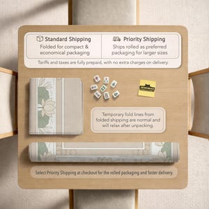 May include: A rolled-up beige and green desk mat with a floral design, next to a folded mat with the same design. The image also shows mahjong tiles and a "DESKNEKO" sticker on a wooden surface.