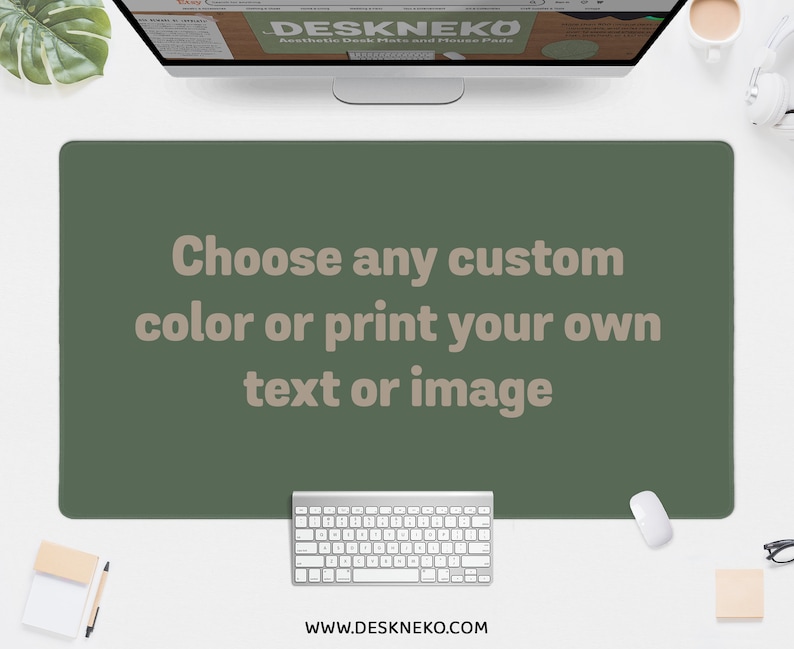 May include: A green desk mat with the text "Choose any custom color or print your own text or image." A white keyboard and mouse are below the mat. The website address www.deskneko.com is at the bottom.