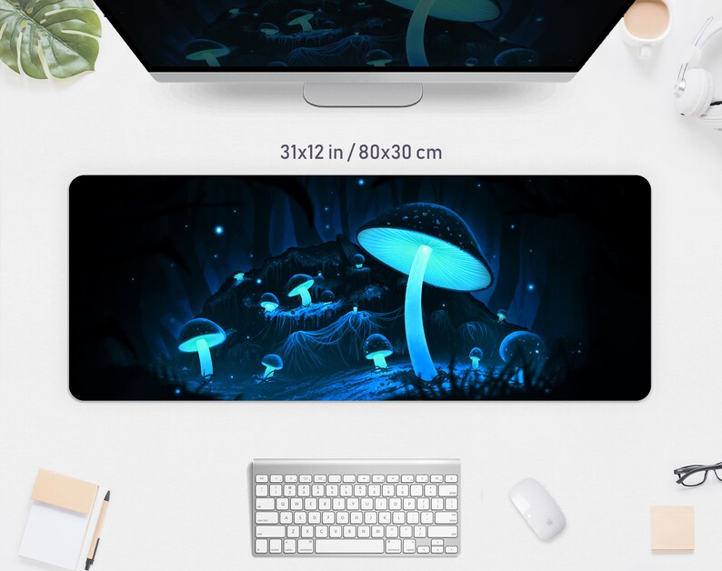 May include: A black desk mat with a glowing blue mushroom design. The mat measures 31 x 12 inches. The design features several mushrooms with bright blue caps and stems, set against a dark, forest-like background. The text "31x12 in / 80x30 cm" is visible.