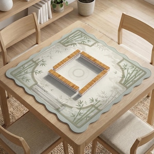 May include: A square mahjong mat with scalloped edges featuring a light green and white bamboo pattern. In the center, four rows of light brown wooden mahjong tiles are arranged in a square formation on a white surface with a circular design.
