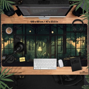 May include: A large desk mat with a forest scene design, measuring 47 x 23.5 inches. The mat features a detailed illustration of a forest interior with a window view. The desk mat has the text "DESKNEKO" and "www.DESKNEKO.COM".