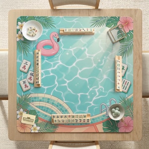 May include: A square wooden mahjong table with a tropical pool-themed mat. The mat features a pink flamingo float, water ripples, and floral accents. Mahjong tiles and accessories are arranged on the mat, ready for play.