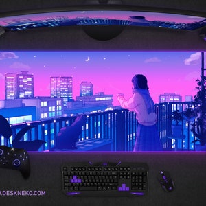 May include: A gaming setup featuring a large, curved monitor above a desk mat with a cityscape design in shades of purple and blue. A keyboard, mouse, and controller are visible, along with headphones. The website address www.deskneko.com is printed on the mat.