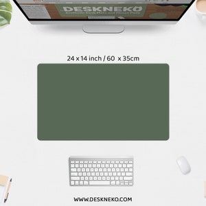 May include: A dark green rectangular desk mat, 24 x 14 inches, sits on a white desk. A computer keyboard, mouse, and monitor are also visible. The monitor displays the text "DESKNEKO Aesthetic Desk Mats and Mouse Pads". The website address www.deskneko.com is at the bottom.
