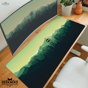 May include: Aesthetic desk mat with a forest scene design. The mat features a gradient of green hues, with a mountain range and a fire tower. The text "WWW.DESKNEKO.COM" is printed on the mat. The DeskNeko logo is in the bottom left corner.