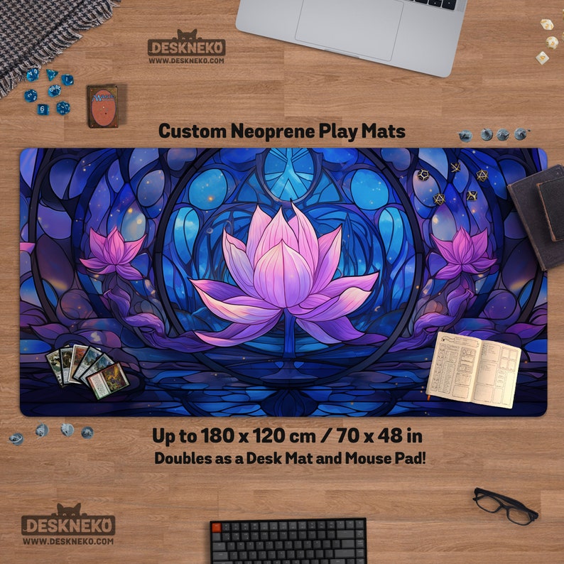 May include: A custom neoprene play mat featuring a lotus flower design in shades of purple and blue. The mat doubles as a desk mat and mouse pad, with dimensions up to 70 x 48 inches. The mat has the text "Custom Neoprene Play Mats" and the website address "DESKNEKO.COM".