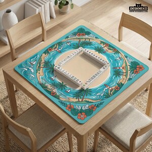 May include: A square wooden table with a turquoise mat featuring a tropical island design. The mat has palm trees, sailboats, and a lighthouse. A Mahjong set is placed on the mat. The table is surrounded by wooden chairs.