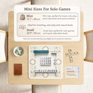 May include: A Mahjong set with teal and white tiles on a floral patterned mat. Includes a bowl of green markers, a brown notebook, and wooden letter tiles spelling N, E, D, S, K, O. A sign displays Mini 15.7 inches and Small 20.9 inches sizes.