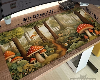 May include: A large rectangular desk mat featuring a forest scene with large red and white spotted mushrooms. The mat is up to 47 inches long and 23.5 inches wide, with the text "Up to 120 cm / 47" and "60cm / 23.5" printed on it.