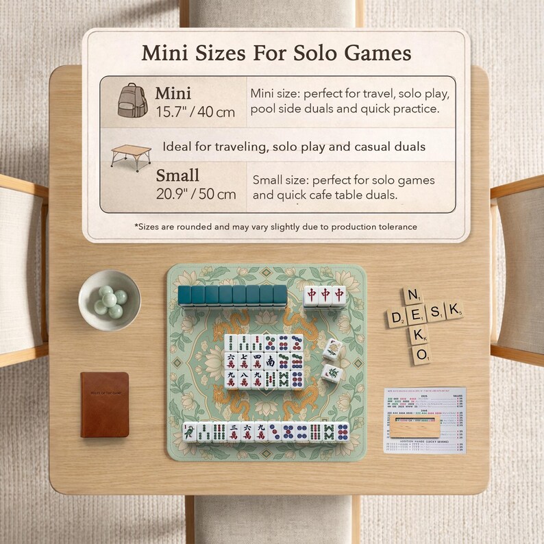 May include: A mini Mahjong set on a wooden table. The set includes tiles, dice, and a green mat with a floral design. The table also has a small bowl with green spheres and a brown notebook. The text on the sign says "Mini Sizes For Solo Games".