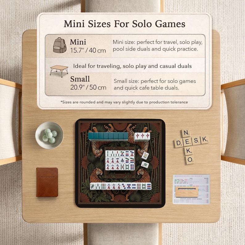 May include: A tabletop mahjong set with a decorative tiger design. The set includes tiles, dice, and a small brown booklet. The image also shows a sign with the text "Mini Sizes For Solo Games" and measurements in inches and centimeters.