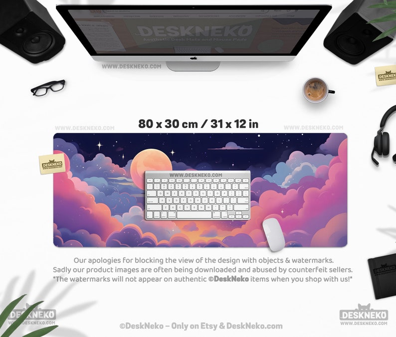 May include: A large desk mat with a dreamy night sky design, featuring a full moon, stars, and colorful clouds in shades of pink, purple, and blue. The mat measures 31 x 12 inches and has a keyboard and mouse on top.