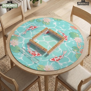 May include: A round desk mat featuring a light blue water surface pattern with white koi fish, pink water lilies, and green lily pads. A square wooden frame sits in the center of the mat. The text DESKNEKO is visible in the top corners.
