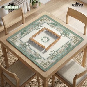 May include: A square mahjong table with a green and white floral design mat. The mat features bamboo and lotus flower illustrations. Four wooden mahjong tiles are arranged in a square in the center. The table is surrounded by four wooden chairs.
